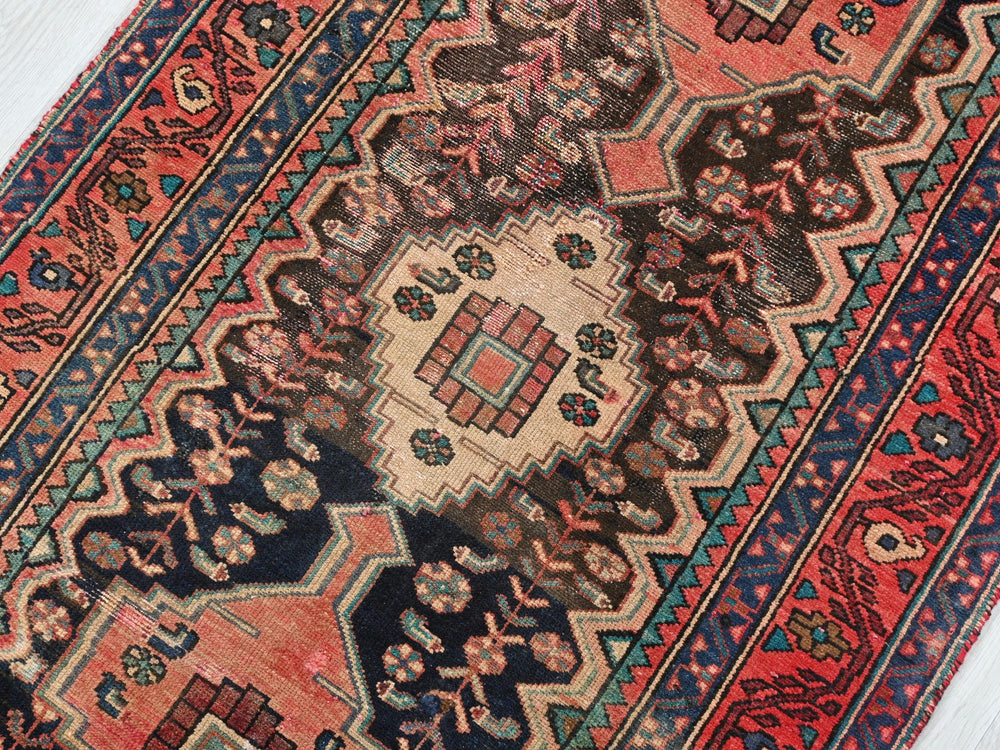 a colorful oriental rug with an intricate design