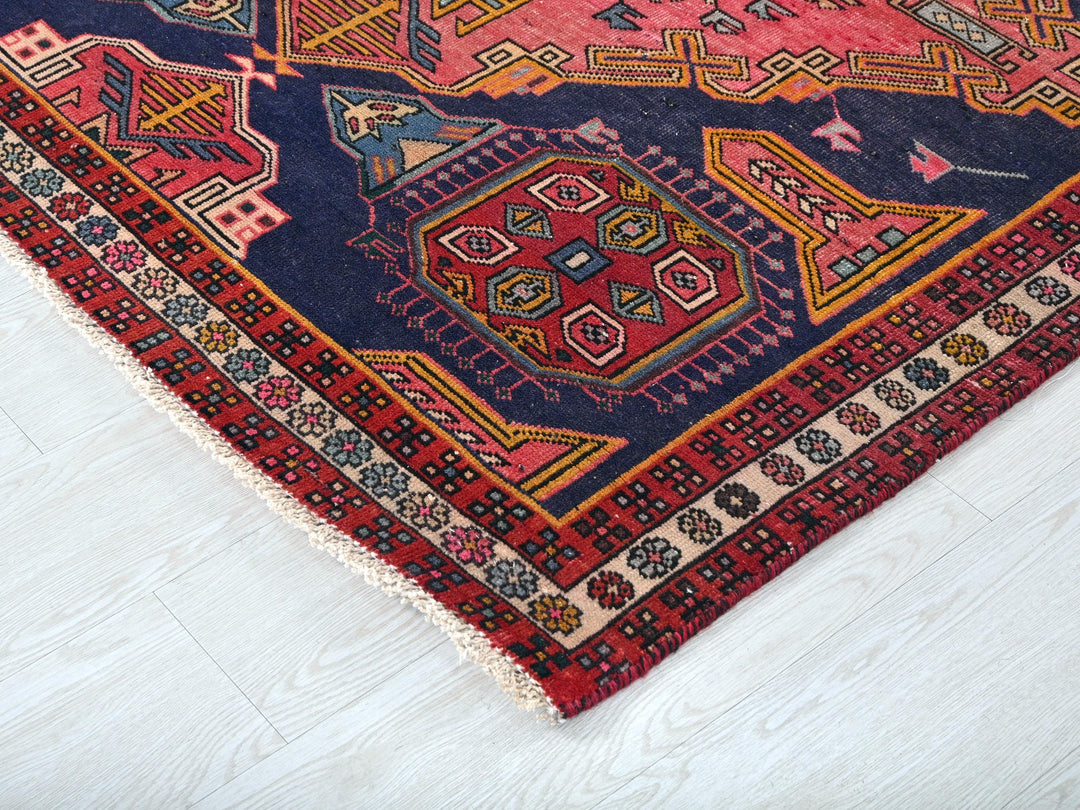 a colorful oriental rug on a white floor