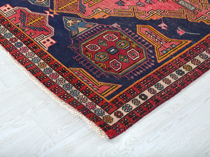 a colorful oriental rug on a white floor