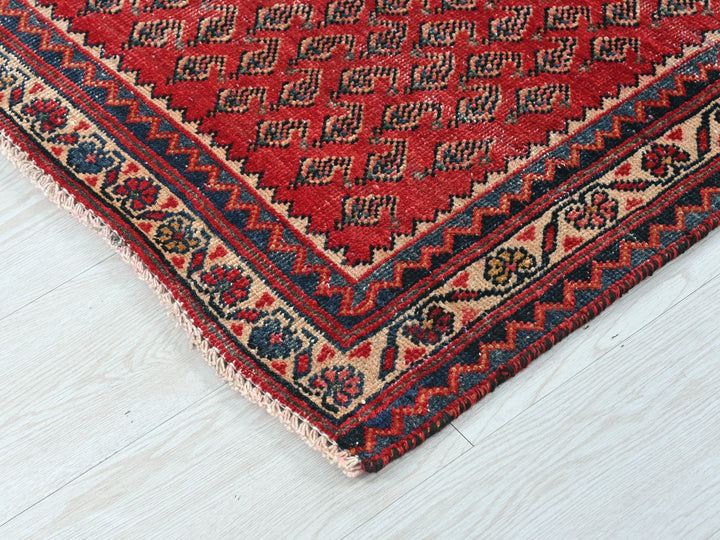 a close up of a rug on a white floor