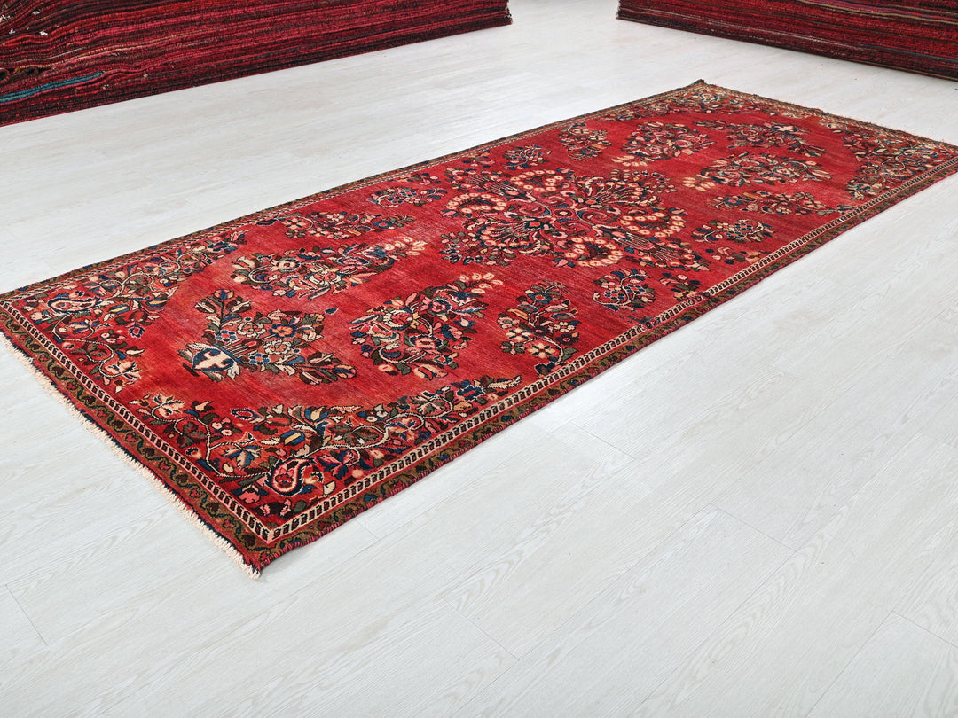 a red rug is laying on the floor
