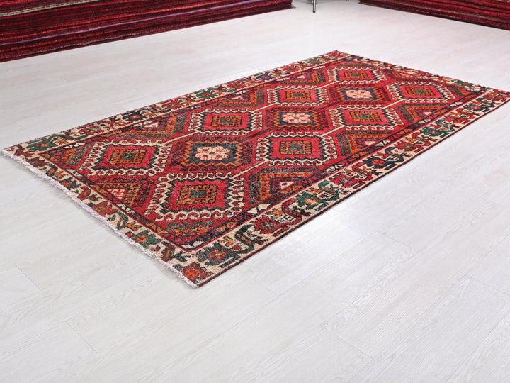 a red rug on a white floor in a room