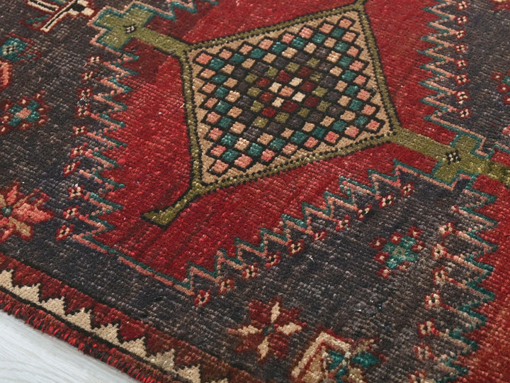 a close up of a rug on a wooden floor