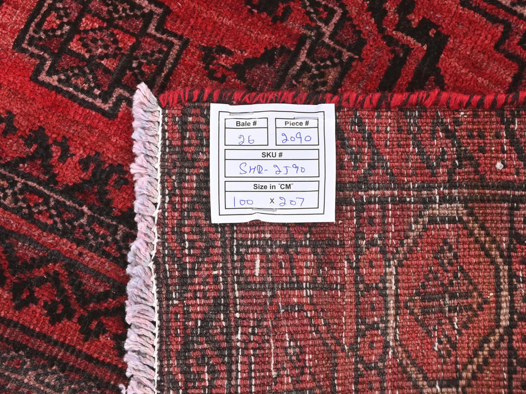 a piece of paper sitting on top of a red rug