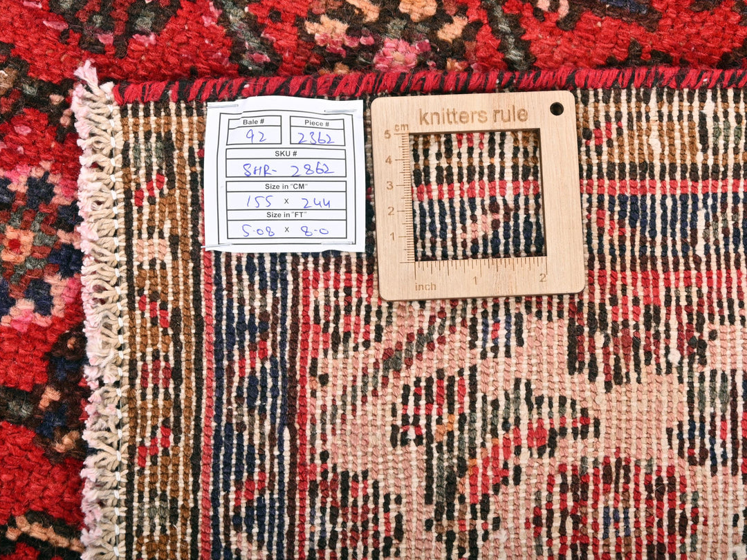 a piece of wood sitting on top of a rug