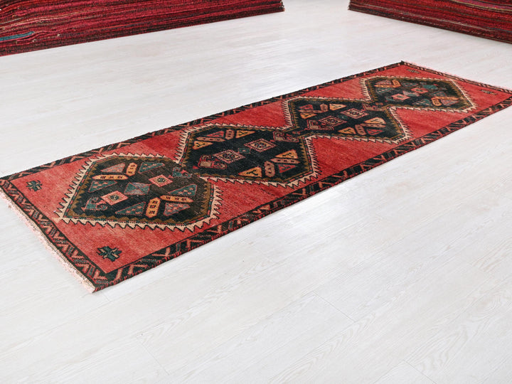 a red rug on the floor of a room