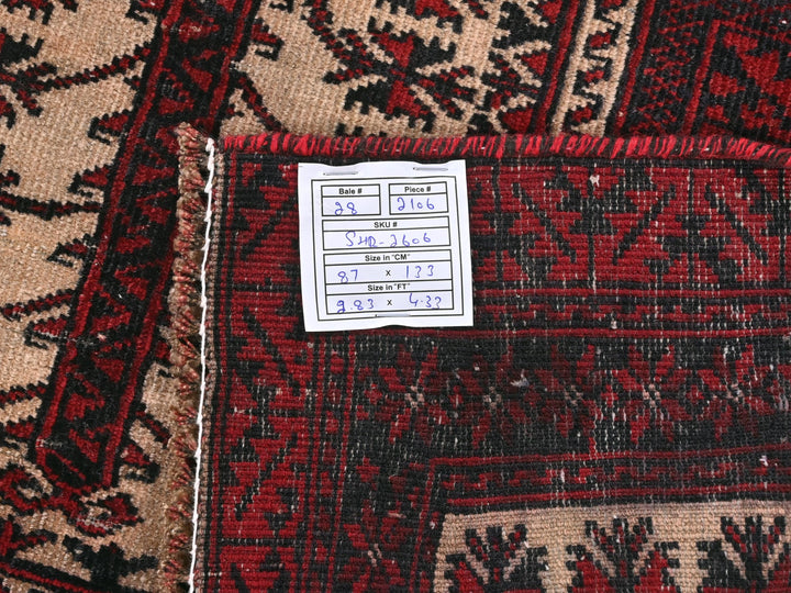 a pile of oriental rugs with a price tag
