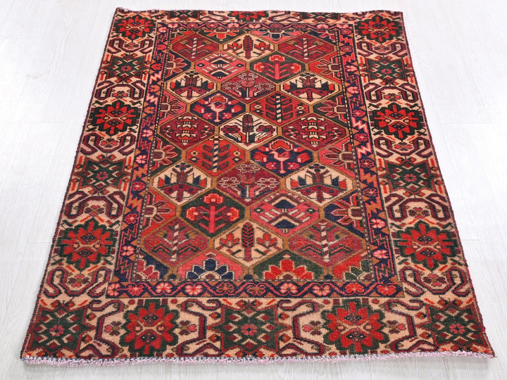 a red and blue rug on a white floor