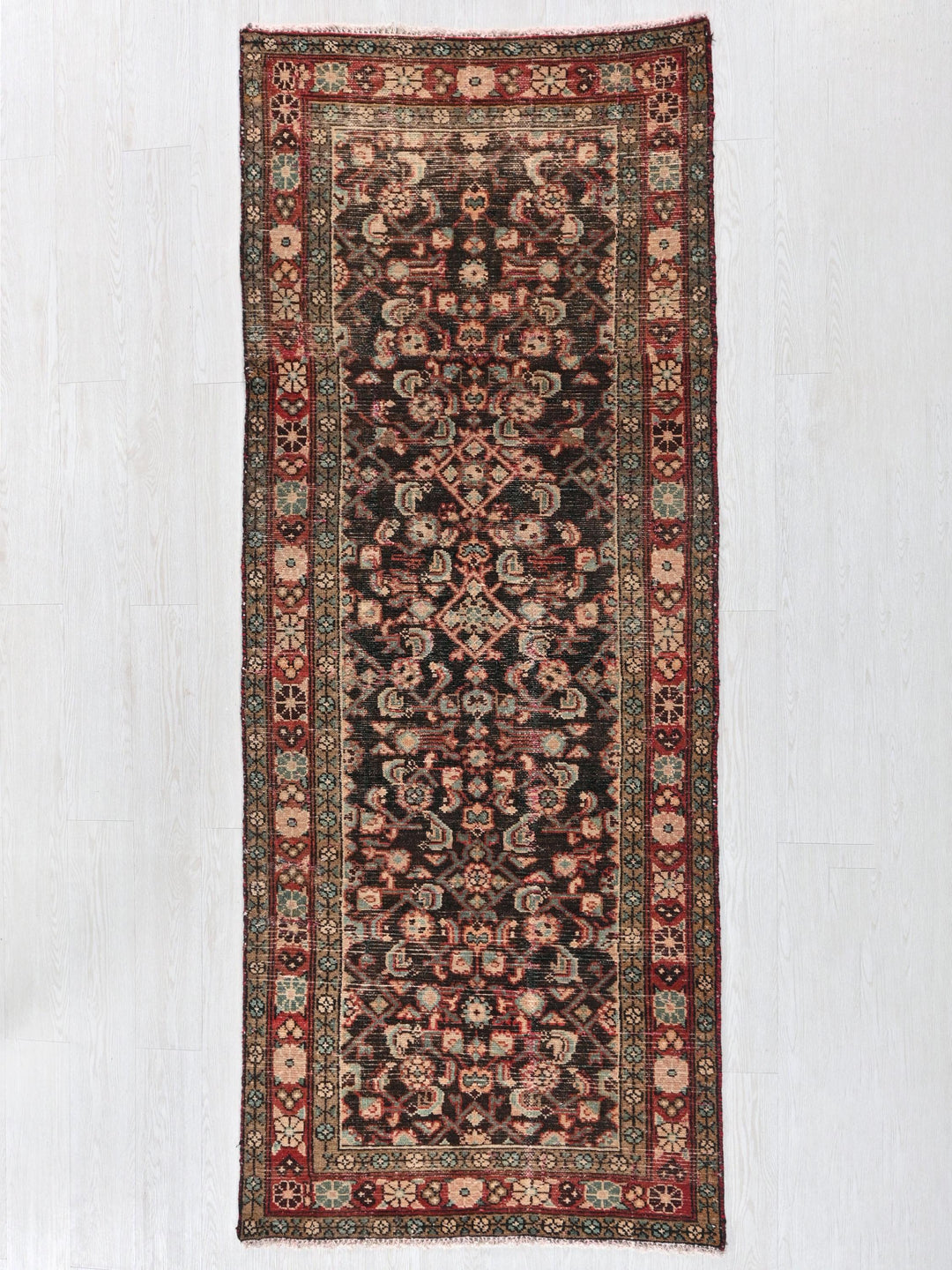 a rug hanging on a wall in a room