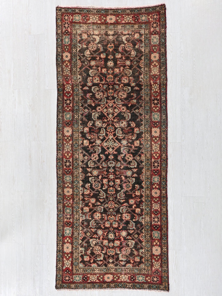 a rug hanging on a wall in a room