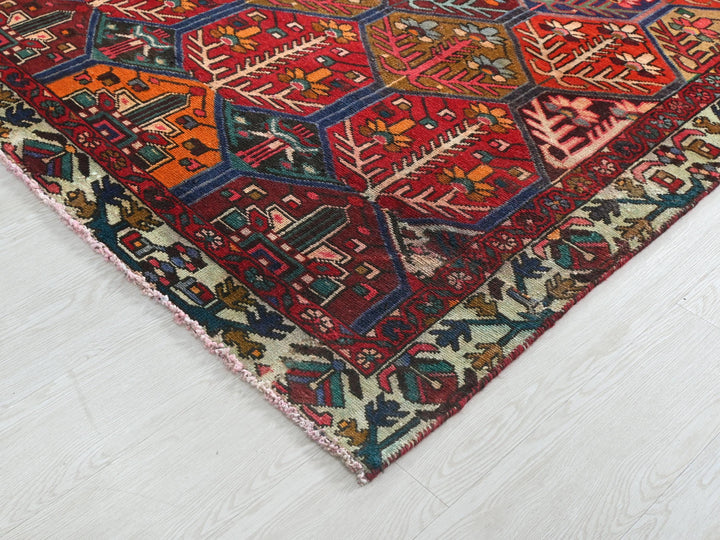 a colorful oriental rug on a white wooden floor