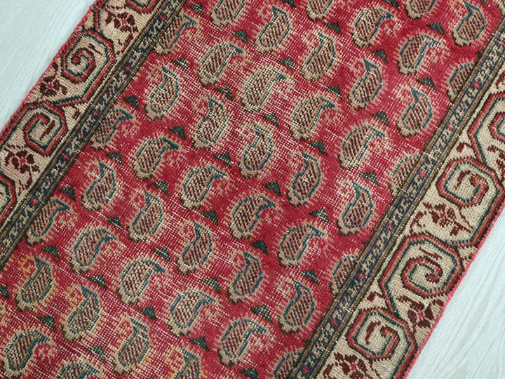 a close up of a rug on a wooden floor