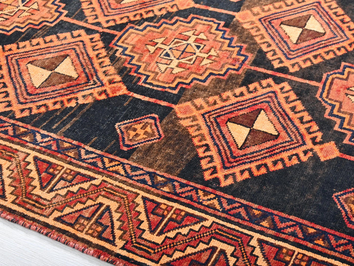 a multicolored oriental rug with geometric designs