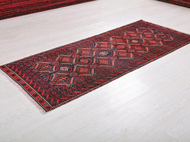 a red rug on the floor of a room