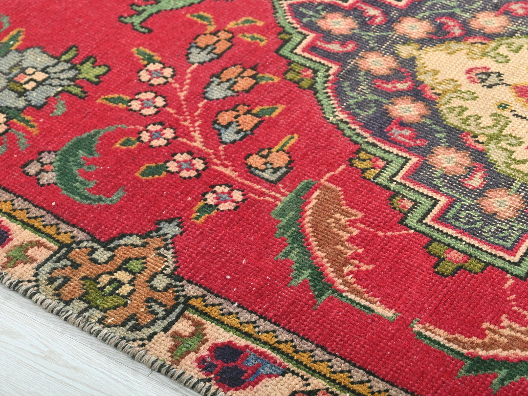 a close up of a rug on a wooden floor