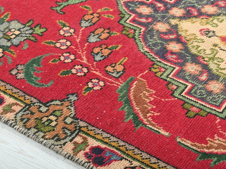 a close up of a rug on a wooden floor