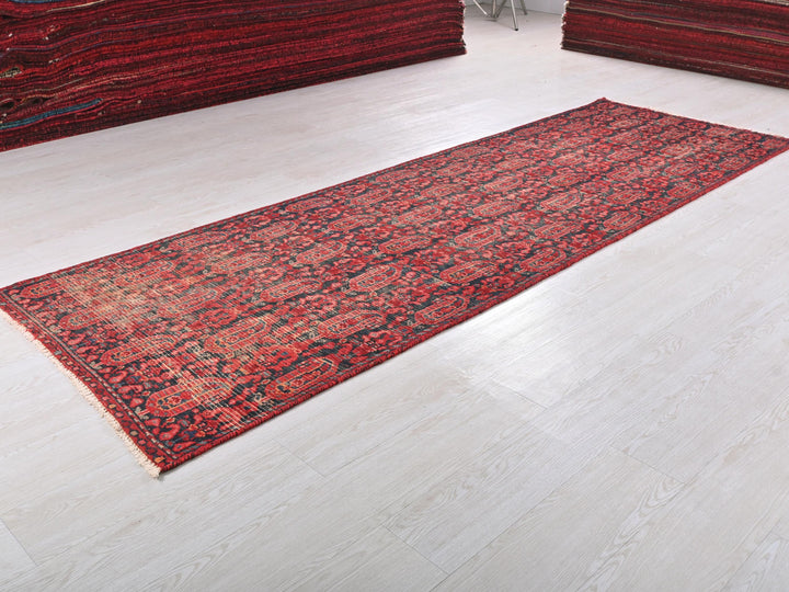 a red rug on a white floor in a room