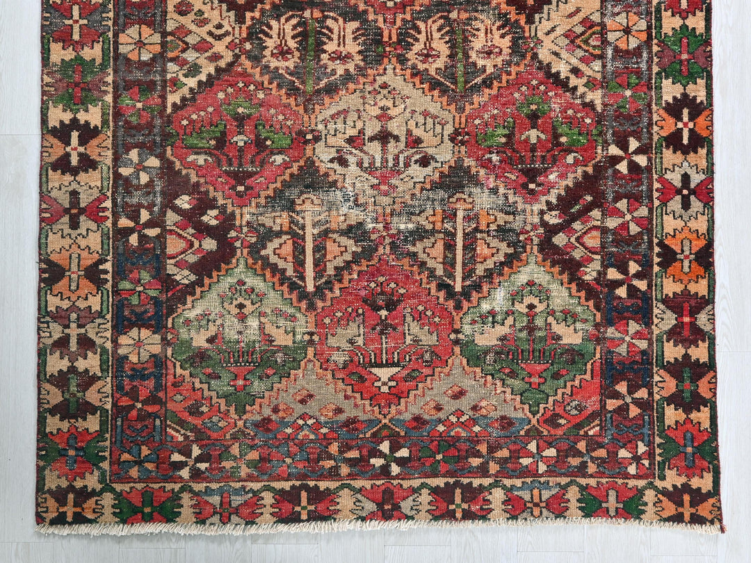 an old rug with a very colorful design on it
