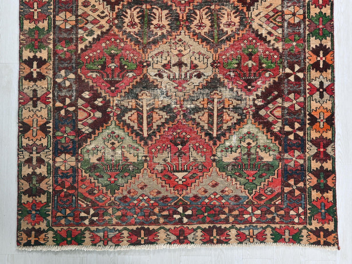 an old rug with a very colorful design on it