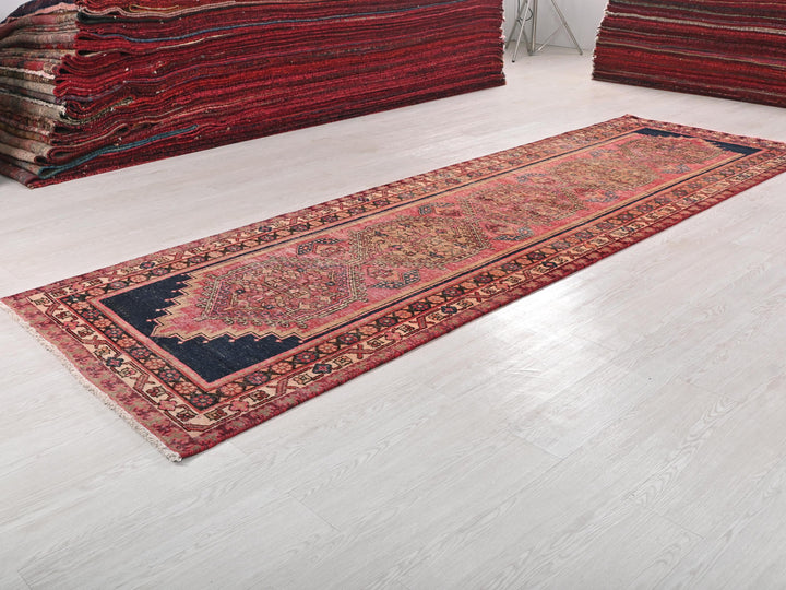 a pile of rugs on the floor in a room