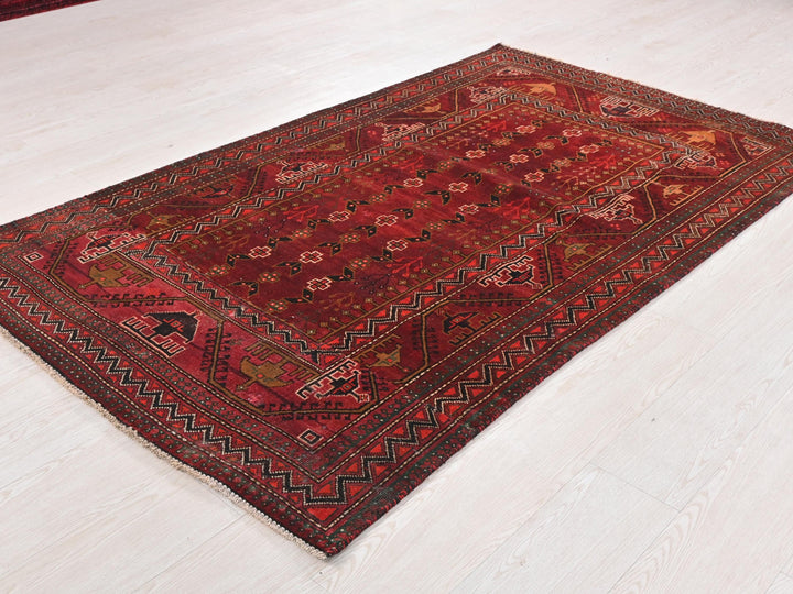 a red rug on the floor of a room