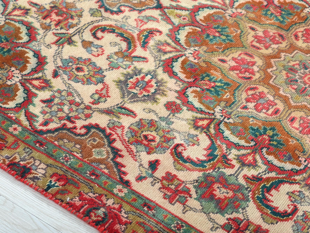 a close up of a rug on a wooden floor