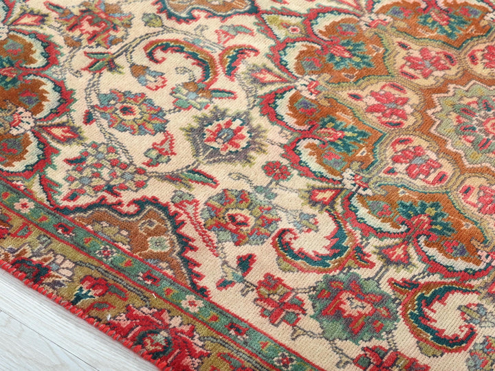 a close up of a rug on a wooden floor
