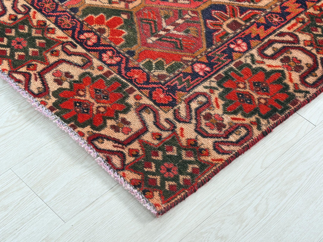 a colorful oriental rug on a white wooden floor