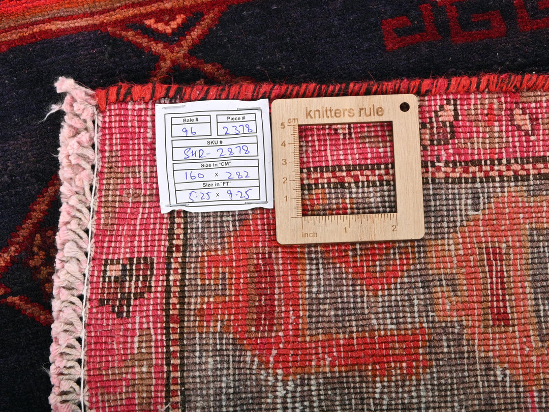 a piece of wood sitting on top of a rug