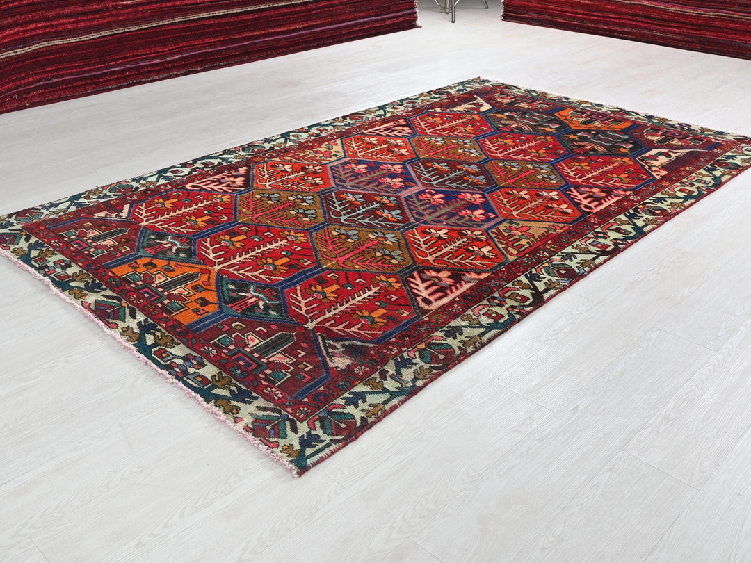a red rug on the floor of a room