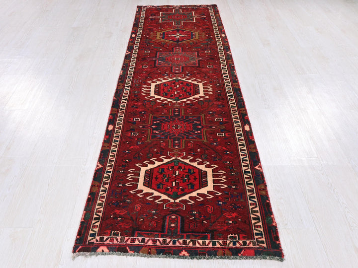 a red runner rug on a white floor