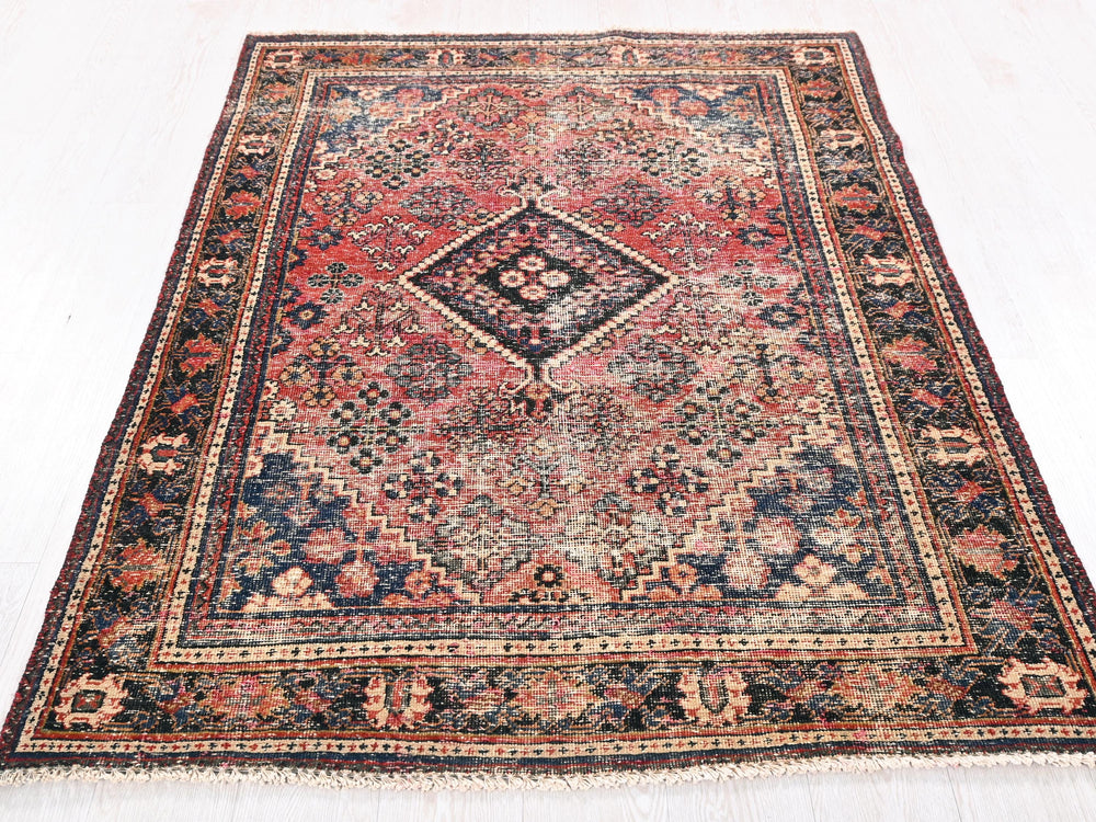 a large oriental rug on a white floor