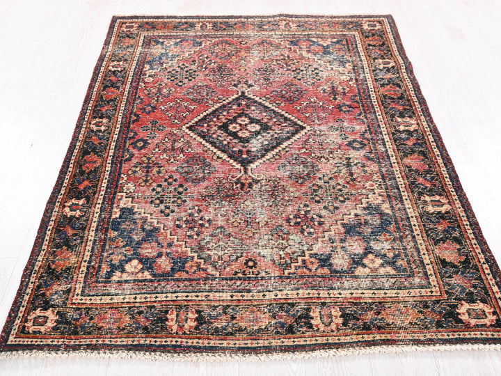 a large oriental rug on a white floor