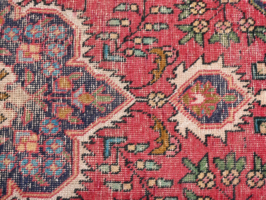 a close up of an oriental rug with many colors