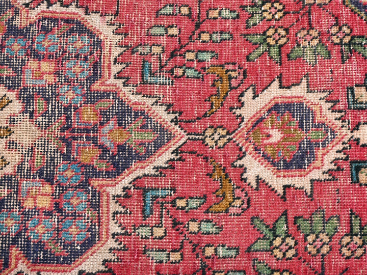 a close up of an oriental rug with many colors