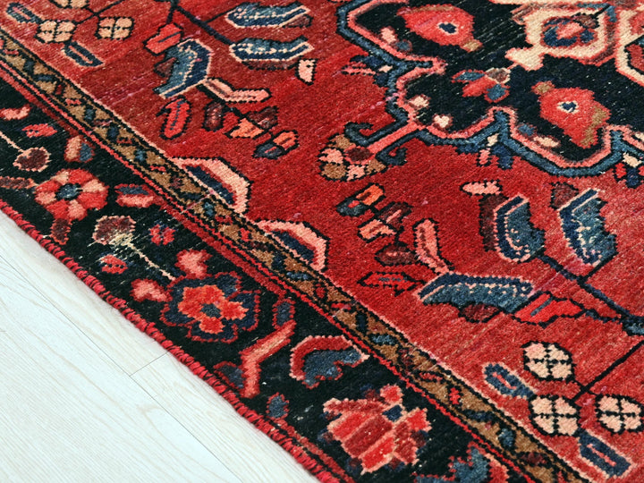 a close up of a rug on a wooden floor