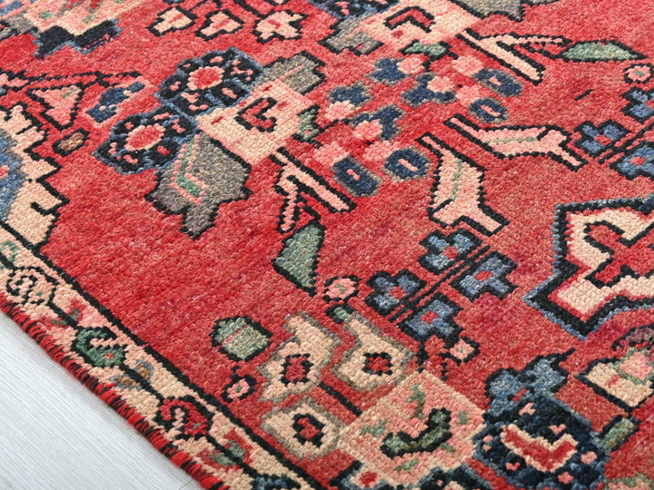 a close up of a red oriental rug