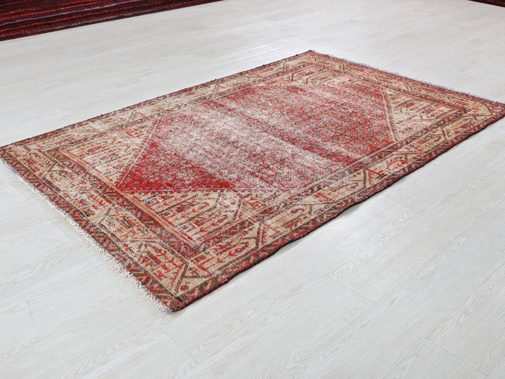 a red rug on a white floor in a room