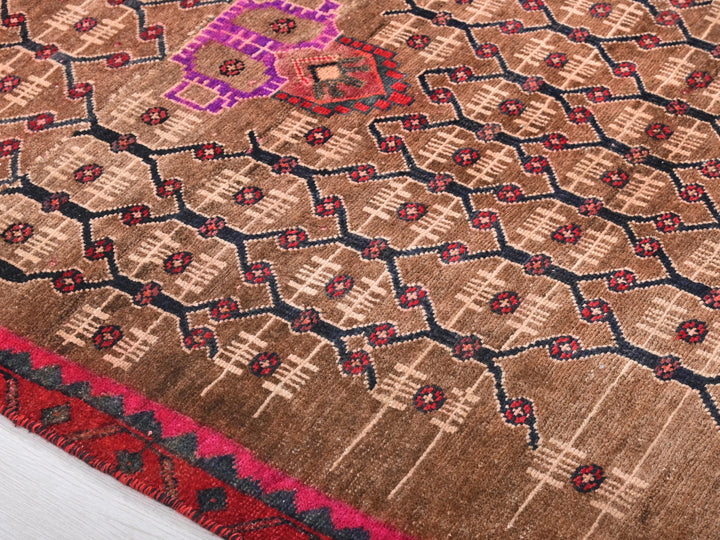 a close up of a rug on a wooden floor