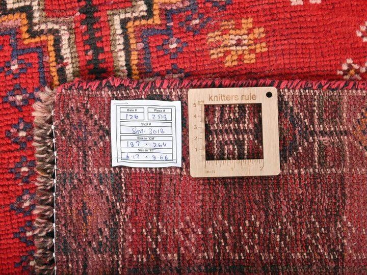 a close up of a rug with a tag on it