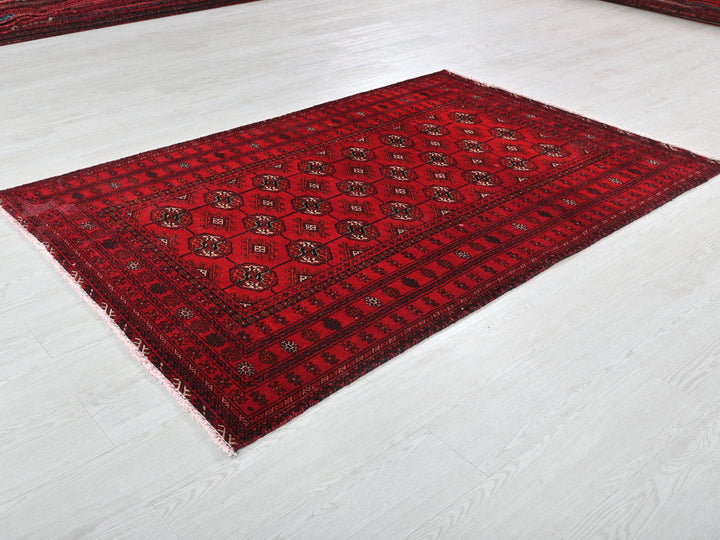 a red rug on a white floor in a room