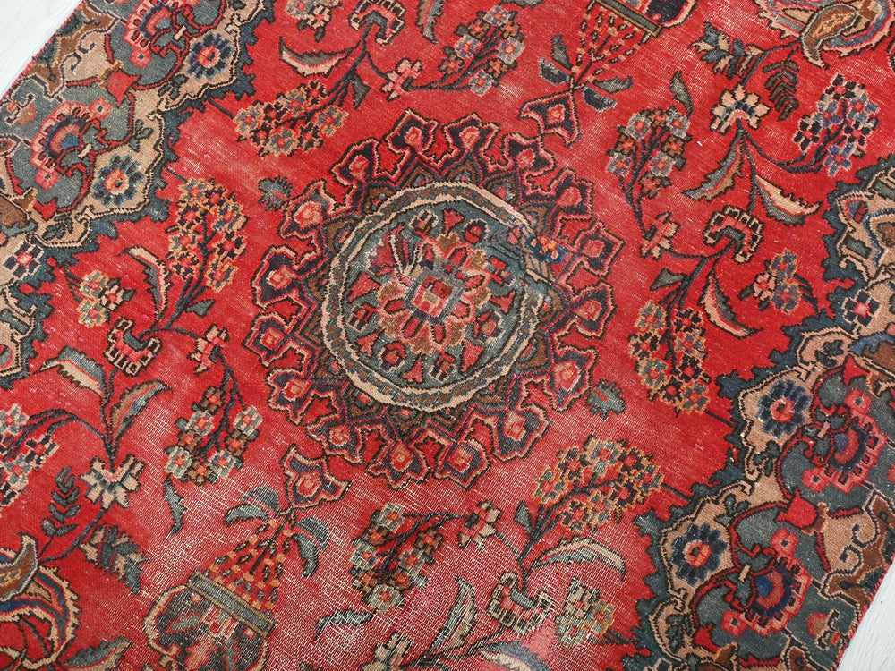 a close up of a red oriental rug