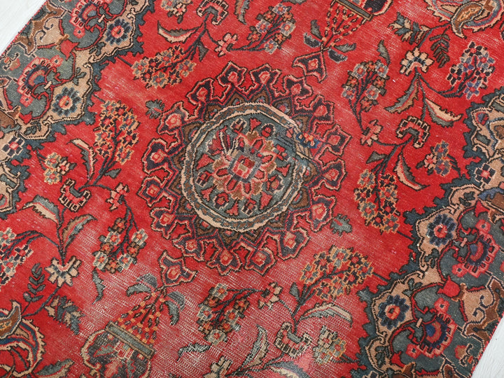 a close up of a red oriental rug