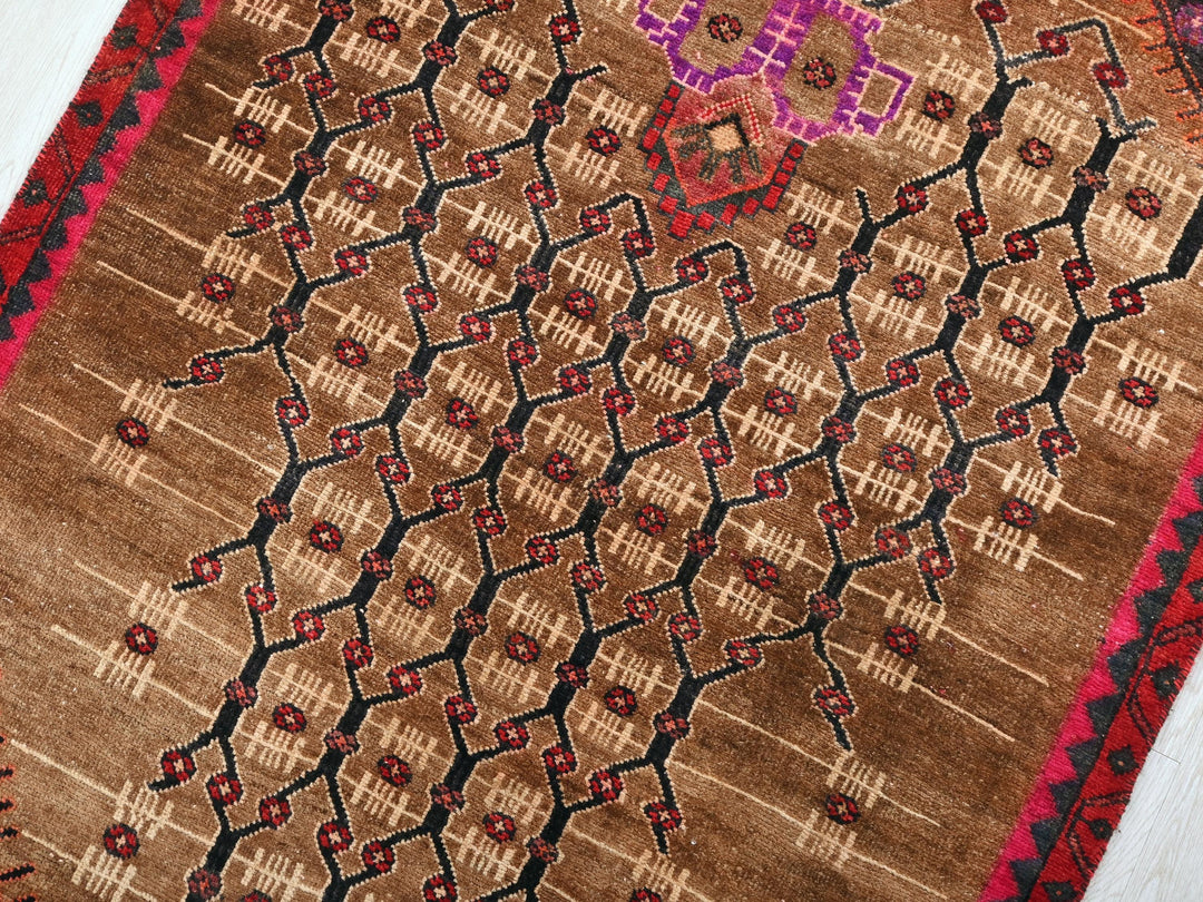 a close up of a rug on a wooden floor
