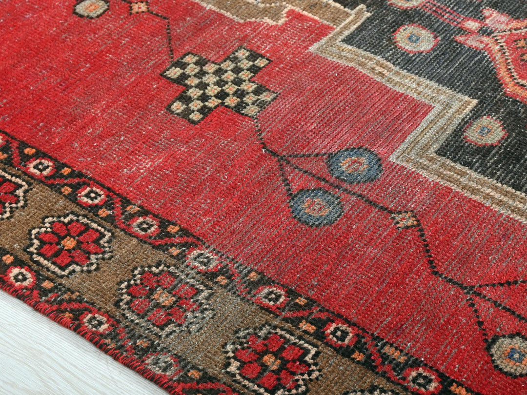 a close up of a rug on a wooden floor