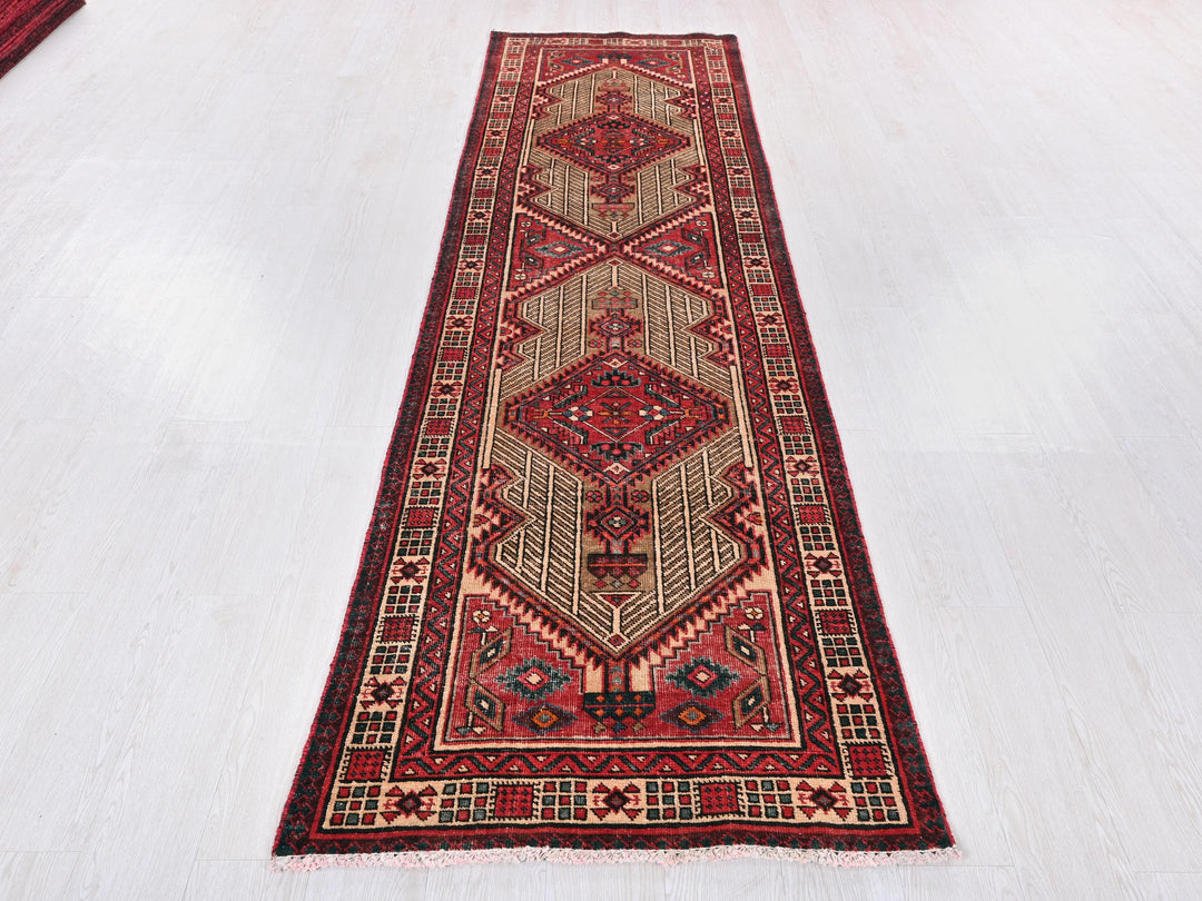 a long red rug on a white floor
