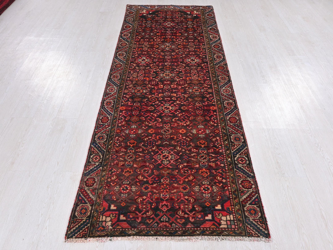 a red rug on a white floor in a room
