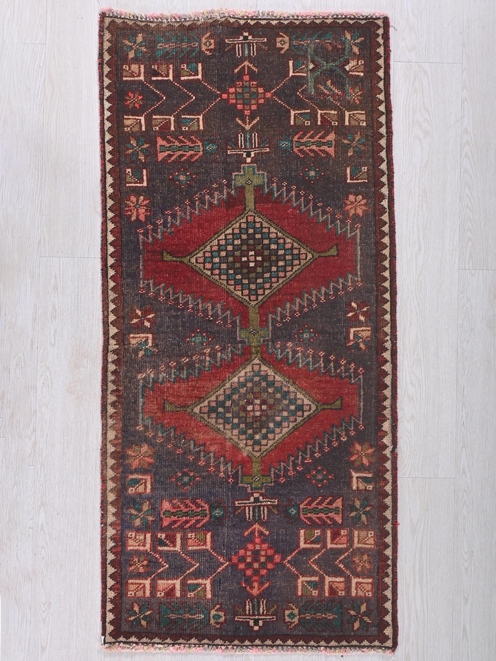 a multicolored rug on a white wooden floor