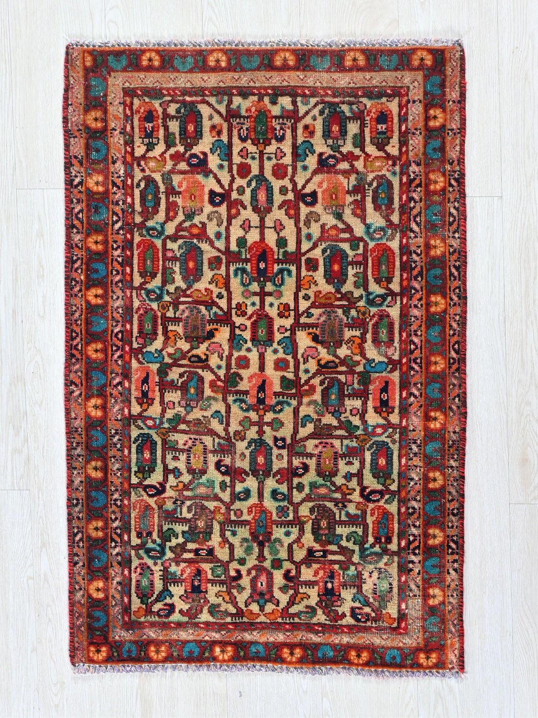 a rug with a colorful design on a white floor