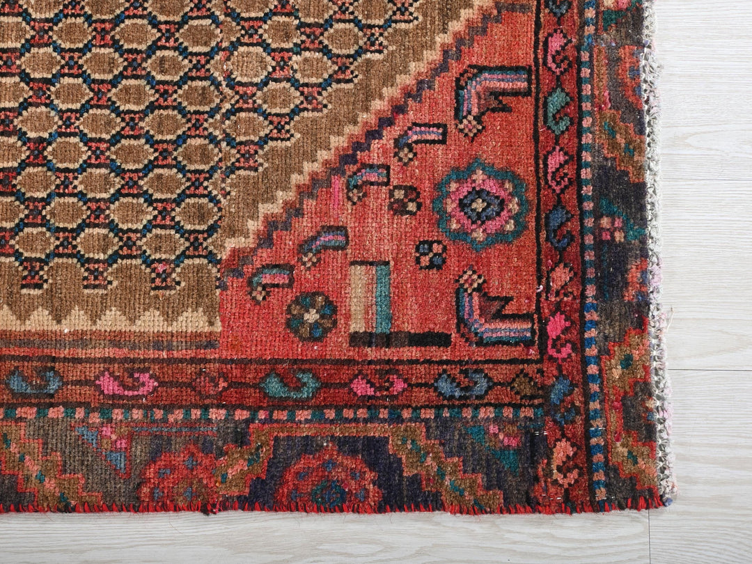 a rug with a design on it on a wooden floor